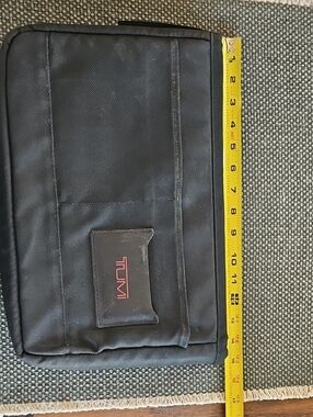 Tumi Black Laptop Sleeve with Red Logo Accent